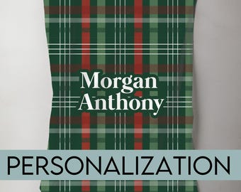 May include: A green, red, and brown plaid blanket with the words "Morgan Anthony" in white. The word "PERSONALIZATION" is written in a teal banner at the bottom of the blanket.