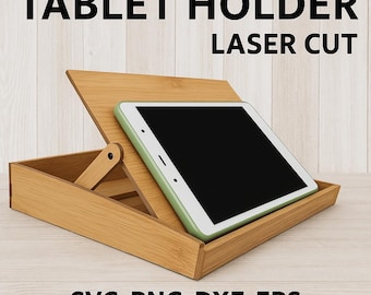 May include: A laser-cut wooden tablet holder with a tablet in a green case. The holder is made of light brown wood and has an adjustable back. The text "TABLET HOLDER LASER CUT" is at the top.