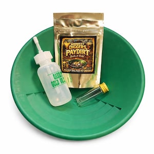 May include: A green plastic gold pan with a gold-colored pouch of "Midwest Diggers Paydirt", a clear plastic bottle with "Garrett Gold Guzzler" text, and a small vial with a yellow cap. The items are for gold panning.