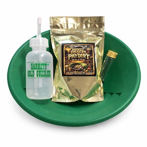 May include: A green plastic gold pan holds a clear plastic bottle labeled "Garrett Gold Guzzler", a gold-colored pouch with "Midwest Diggers Paydirt" text, and a small glass vial. The kit is designed for gold prospecting.