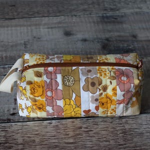 Quilted cosmetic bag handmade from vintage sheet fabric