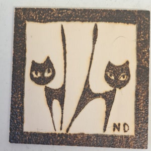 Pyrographed work of cats