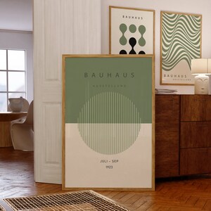 May include: A green and white Bauhaus poster with the text "Bauhaus Ausstellung Juli - Sep 1923" and a graphic of a circle with vertical lines.