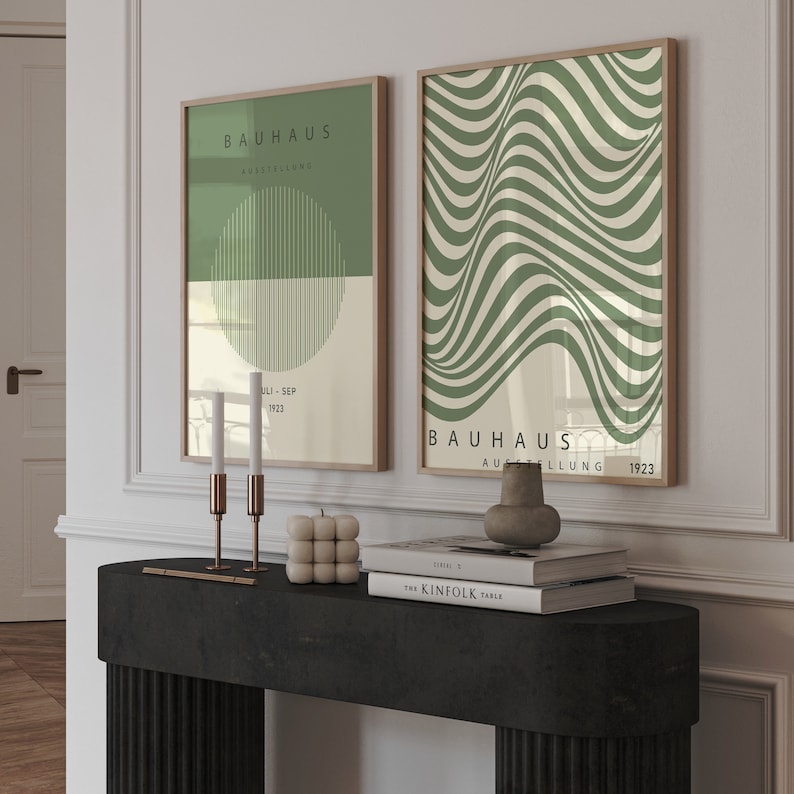 May include: Two framed prints with a green and white geometric design. The prints feature the text "Bauhaus Ausstellung" and the dates "Juli-Sep 1923" and "1923".