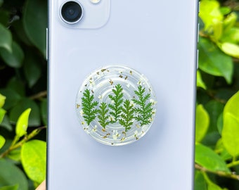Soporte para teléfono con diseño de árbol de Navidad, con encaje de flores y nieve, hojas verdes secas y flores prensadas hechas a mano.