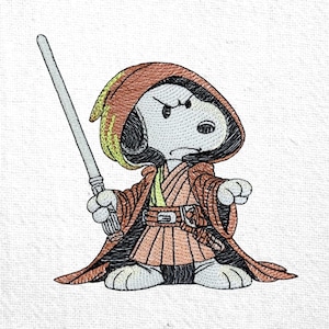 May include: Embroidered Snoopy character dressed as a Jedi, holding a lightsaber. The design features Snoopy in a brown robe with a hood, a yellow undershirt, and a belt. The lightsaber is silver. The background is white.
