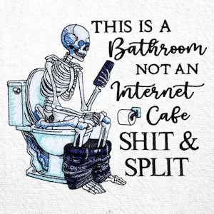 May include: Embroidered white bathroom hand towel with a skeleton on a toilet, using a phone. Text reads "THIS IS A BATHROOM NOT AN INTERNET CAFE SHIT & SPLIT". The toilet and skeleton have blue detailing.