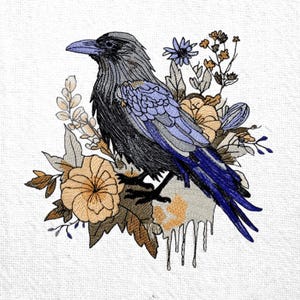 May include: An embroidered design of a raven with blue, grey, and black plumage, surrounded by tan and blue flowers and foliage. The artwork is set against a white background, highlighting the detailed stitching and colour palette.