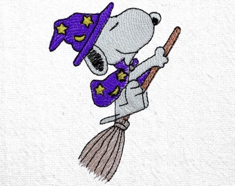 May include: Embroidered image of Snoopy, the cartoon dog, dressed as a wizard. Snoopy wears a purple wizard hat and cape with yellow stars and crescent moons. He is riding a brown broom against a white background.