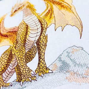 Winged creature embroidery