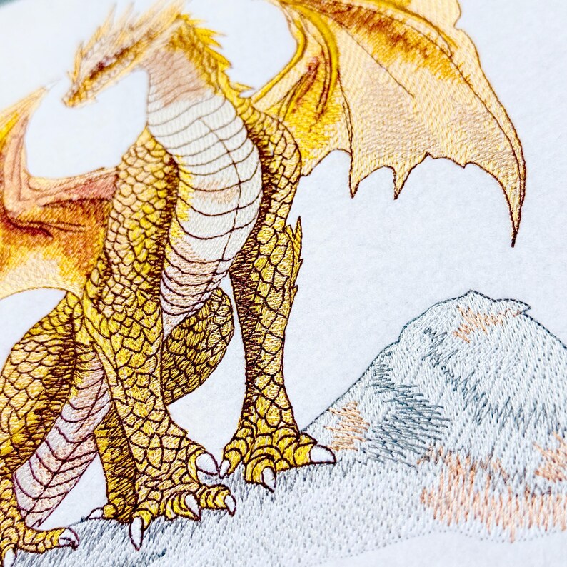 Winged creature embroidery