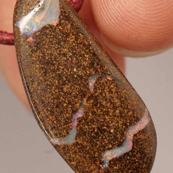 22.65ct boulder opal pendant with great play of colors