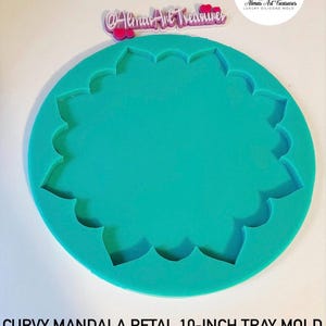 May include: A turquoise silicone mould for making a 10-inch tray with a curvy mandala petal design.