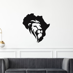 May include: Black and white graphic of a lion's head within the outline of the African continent. The lion's mane and face are detailed, with a focus on the eyes and beard. The artwork is likely a wall decal or print.