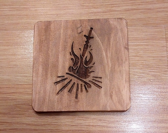 Sottobicchiere in legno per bevande con fan art del falò di Dark Souls