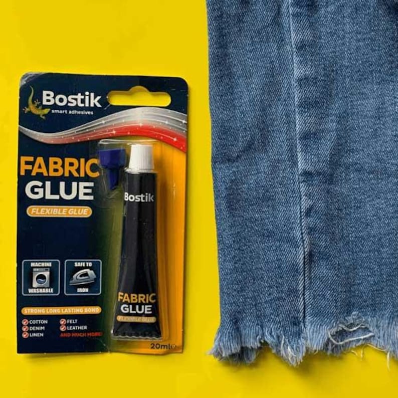 May include: A tube of Bostik Fabric Glue, a flexible glue for fabrics like cotton, denim, felt, leather, and linen. The tube is 20ml and is shown on a yellow background with a piece of blue denim.