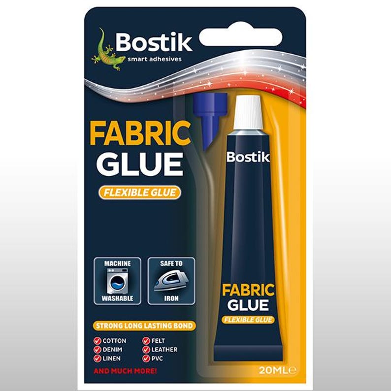 May include: A blue tube of Bostik Fabric Glue with a white label. The label says "Bostik Fabric Glue Flexible Glue" and has a picture of a washing machine and an iron. The tube is 20 ml.