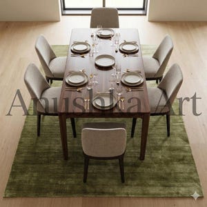 May include: A modern dining table set for six. The dark wood table is set with white plates, gold cutlery, and wine glasses. Six upholstered chairs surround the table, set on a green rug. The room is well-lit with natural light.