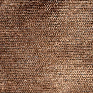 May include: Close-up of a textured brown fabric. The surface is covered in small, tightly packed, rounded bumps, creating a tactile and visually interesting pattern. The color is a warm, earthy brown.