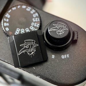 Protector de zapata para cámara con base negra de Doctor Plaga, botón de obturador, accesorio personalizado para cámara