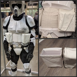 Può includere: Un costume da Stormtrooper bianco e nero con un elmetto bianco e un pezzo toracico nero. Il costume è fatto di tessuto e plastica e ha una varietà di tasche e cinghie. Il costume è indossato da una persona, ma la persona non è visibile nell'immagine.