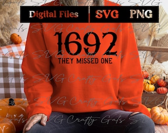 May include: An orange sweatshirt with the text "1692 THEY MISSED ONE" in black. The top of the image has the words "Digital Files", "SVG", and "PNG" in white text on a black background. The image has a fall theme with pumpkins.