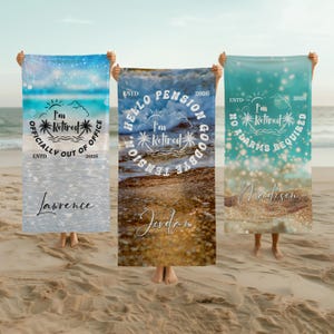 May include: Three beach towels with retirement messages. The towels display phrases such as "Officially Out of Office," "Hello Pension Goodbye Tension," and "No Alarms Required." Each towel has a name and the year 2026 printed on it. The backgrounds show beach scenes.