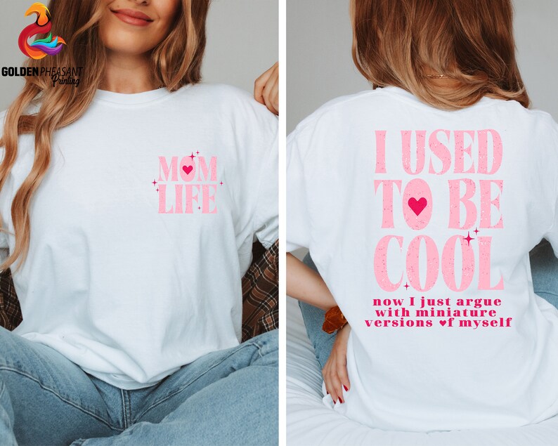 May include: White t-shirt with pink text that says "MOM LIFE" with a pink heart on the front and a white t-shirt with pink text that says "I USED TO BE COOL now I just argue with miniature versions of myself" on the back.