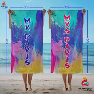 May include: Two 60-inch by 30-inch beach towels with colorful abstract designs. One towel reads "MR DAVIS" in blue, the other reads "MRS DAVIS" in red. The towels have a vibrant mix of colors including blue, pink, yellow, and teal.