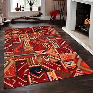 May include: A colorful patchwork rug with a geometric pattern in shades of red, orange, blue, and green. The rug is made of woven fabric and has a distressed look.