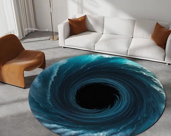 May include: A round rug with a swirling blue and black design that resembles a whirlpool. The rug is on a light gray floor.