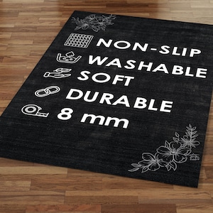 May include: Black rug with white text and icons that say "NON-SLIP", "WASHABLE", "SOFT", "DURABLE", and "8 mm".