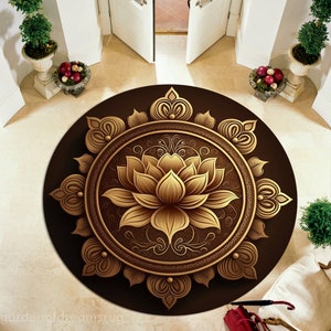 May include: A round brown doormat with a gold mandala design featuring a lotus flower in the center. The mandala is surrounded by intricate floral patterns.