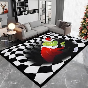 May include: A black and white checkered rug with a green and red Grinch character in the center. The Grinch is wearing a red Santa suit and has a mischievous expression on his face.