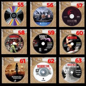 Pode incluir: Uma cole&ccedil;&atilde;o de discos de videojogos com t&iacute;tulos da s&eacute;rie Resident Evil e "Call of Duty: Modern Warfare". Os discos apresentam gr&aacute;ficos e t&iacute;tulos de jogos variados.