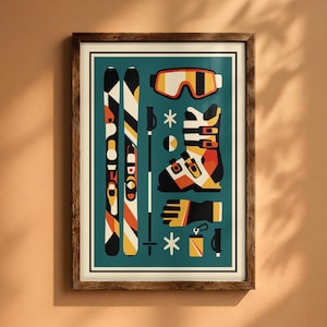 May include: A framed wall art print featuring a flat graphic illustration of skiing equipment on a teal background. The design includes two skis, a pair of goggles, a ski boot, a pole, a glove, and small accessories in orange, yellow, black, and white.