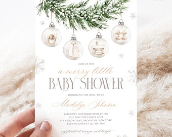 May include: A baby shower invitation with a winter theme. The invitation features watercolor illustrations of baby items inside clear ornaments hanging from a pine branch. The text reads "a merry little BABY SHOWER" and includes event details.