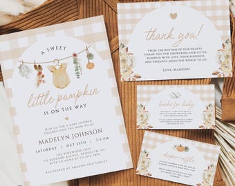 May include: Baby shower invitation set with a pumpkin theme. The invitation features the text "A sweet little pumpkin is on the way" and includes details for the event. The set includes thank you, books for baby, and diaper raffle cards.