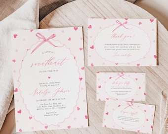 May include: A set of pink baby shower invitations and thank you cards. The invitation features the text "A Little Sweetheart is on the Way" with a pink bow and heart accents. The thank you card has a similar design.