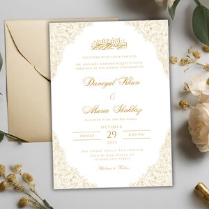 May include: Gold wedding invitation with ornate floral designs. The invitation announces the marriage of Daniyal Khan and Maria Shahbaz on Friday, October 29, 2025 at 8:00 PM at The Great Hotel Auditorium in Istanbul, Turkey.