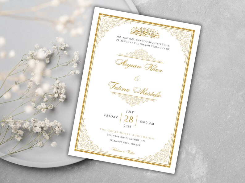 May include: A white wedding invitation with gold calligraphy and ornate borders. The invitation announces the marriage of Aryaan Khan and Fatima Mustafa on Friday, July 28, 2025 at 8:00 PM at The Great Hotel Auditorium, Country Road Avenue 477, Istanbul City, Turkey.