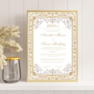 May include: A white Islamic marriage certificate with gold and pink floral designs. The text reads "This agreement is to certify that the marriage of Areesha Mirza & Saim Mushtaq has been solemnized in accordance to the requirements of the Islamic Shariah Law with the agreed upon Mehr of $1,000. Made on the 17th day of January 2023 (corresponding to the 27th day of Rajab 1444) in the city of Toronto, Ontario."