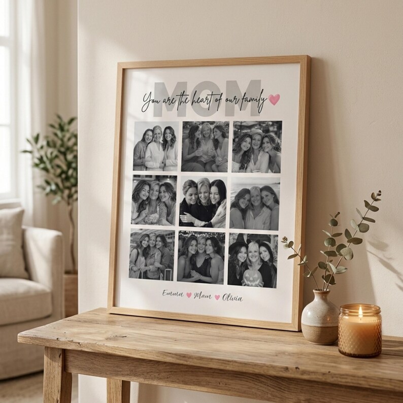 May include: A framed photo collage with a light wood frame. The collage features nine black and white photos of women. The word "MOM" is at the top, with the phrase "You are the heart of our family". Below the photos are the names "Emma", "Mom", and "Olivia".