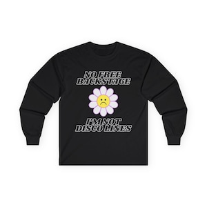 May include: Black long-sleeve shirt with the text "NO FREE BACKSTAGE I'M NOT DISCO LINES" in white. A sad-faced daisy graphic is centered on the shirt. The shirt is made of a soft, comfortable material.