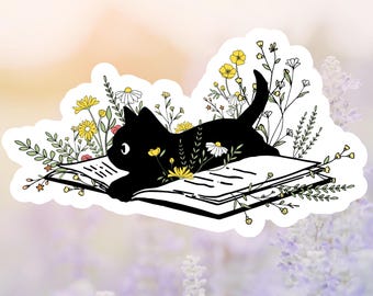 Black Cat Lying On Open Book With Wildflowers Sticker