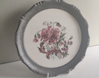 Vintage  pewter plate with flower decorated porcelain inlay