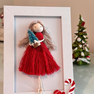 macrame doll in frame