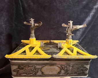 Pair of vintage L.R. Nelson lawn sprinklers