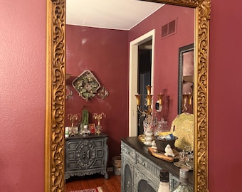 Vintage gold Baroque-style ornate wall mirror