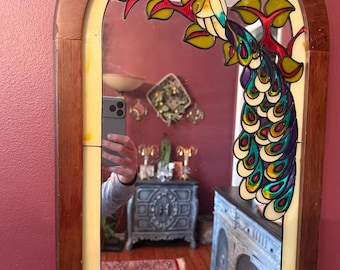 Vintage/antique wood-framed mirror with stained-glass style painted peacock and floral design